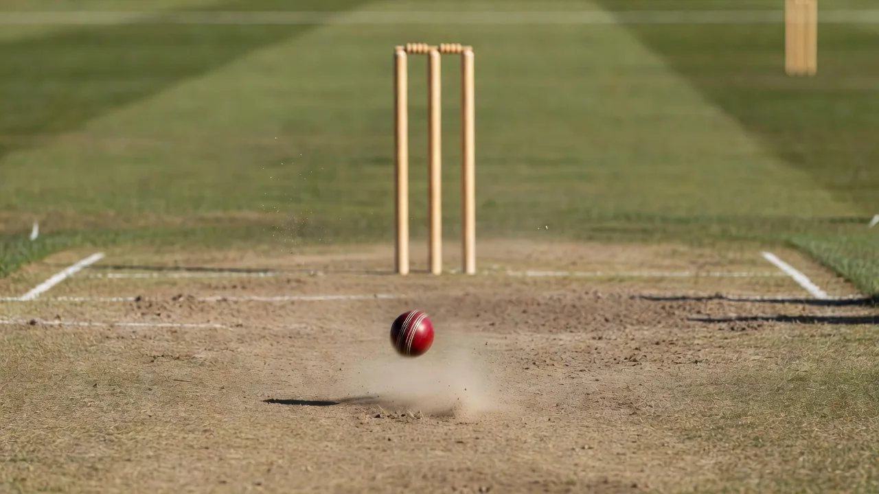 Cricket ball in motion low over the pitch